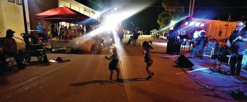 Toddlers enjoying the live music at a past Night on the Town event.